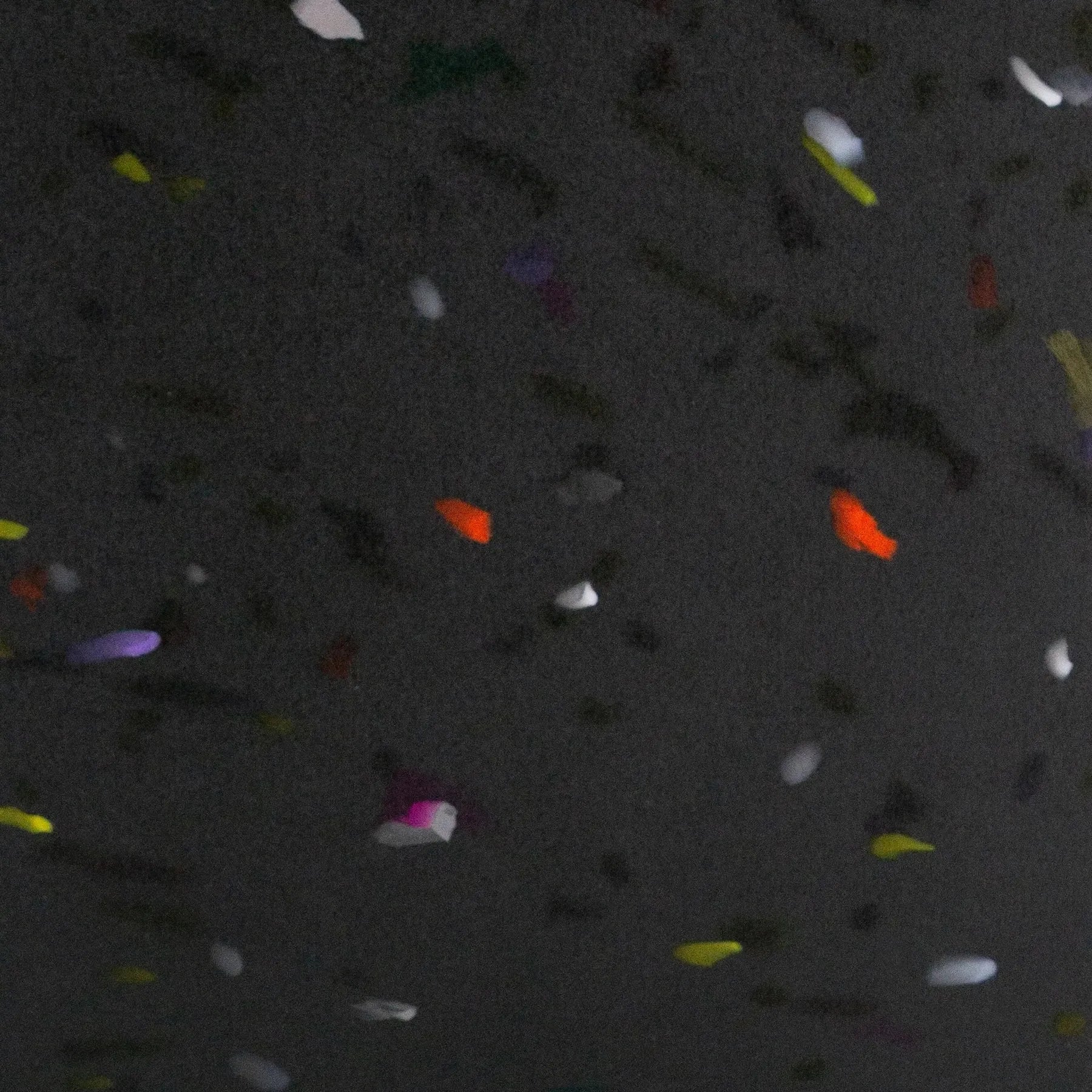 Colorful confetti scattered on a dark textured surface  rPETG recycled plastic panel