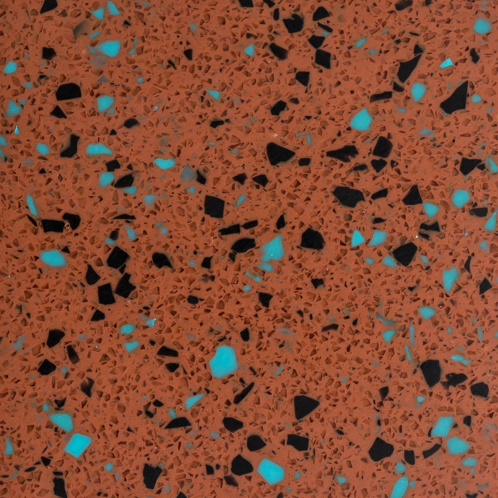 Terrazzo pattern with orange, black, and blue chips on a brown background - Polymer sheet