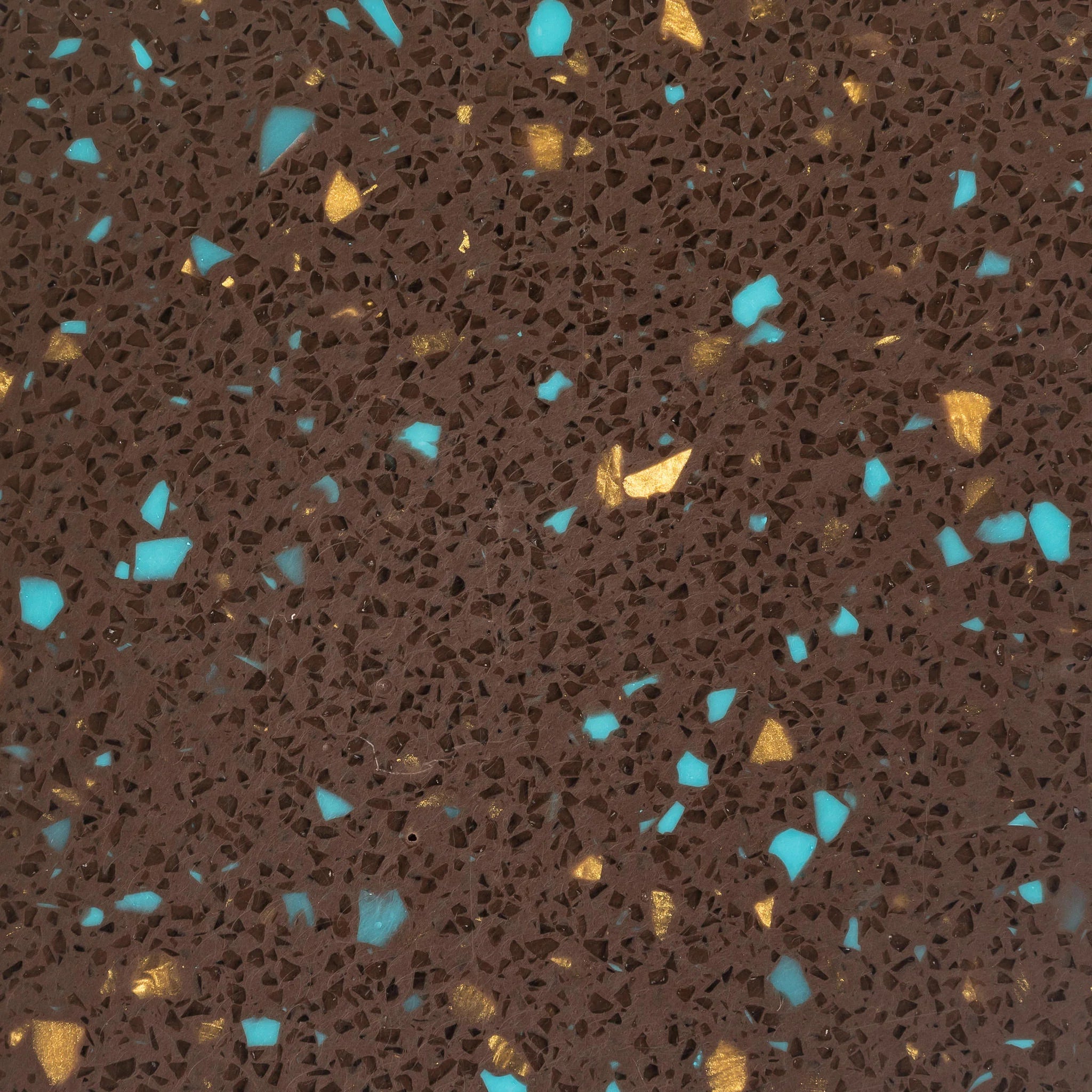 Patterned surface with blue and gold specks on a brown background - Polymer sheet