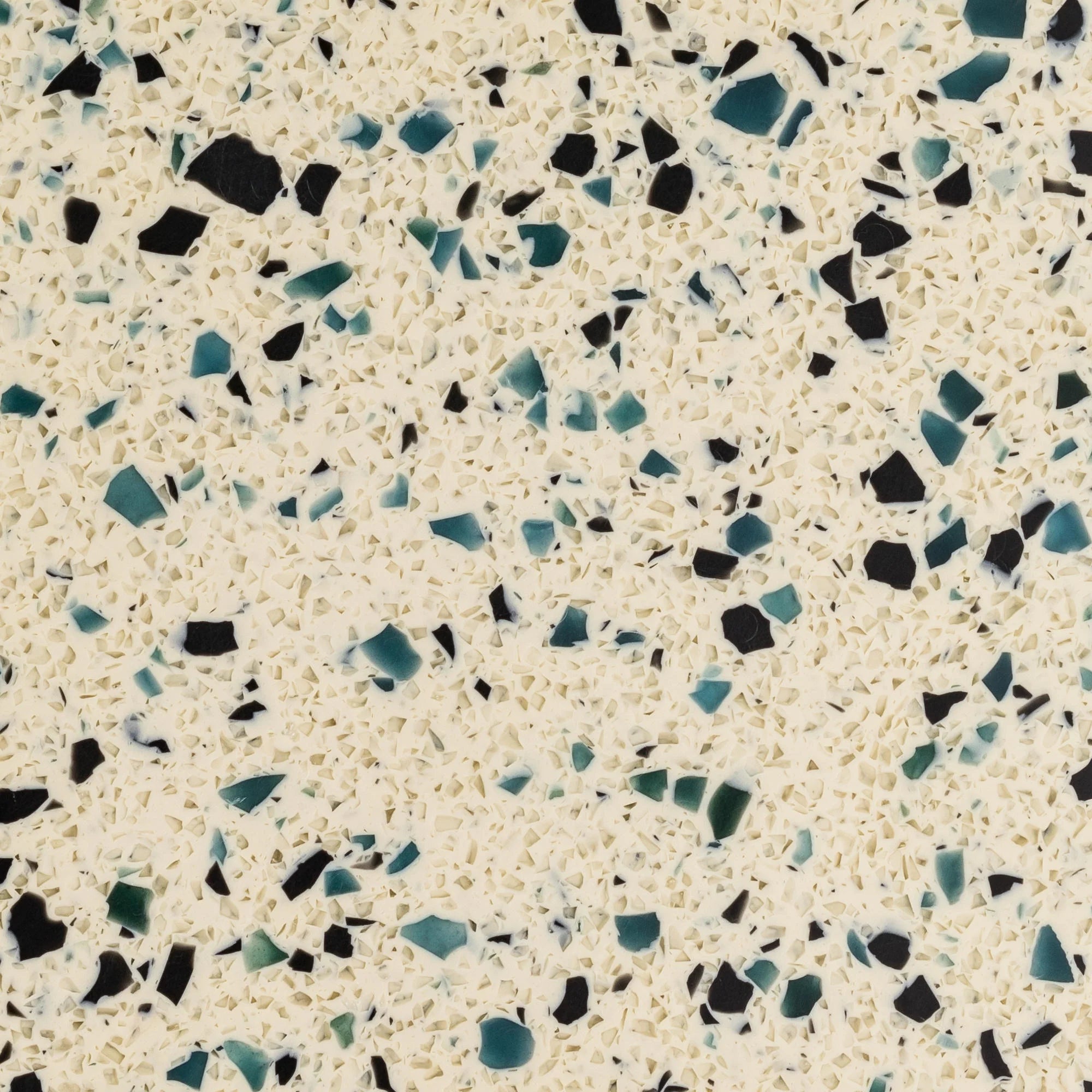 Patterned surface with black, blue, and green specks on a beige background - Polymer sheet