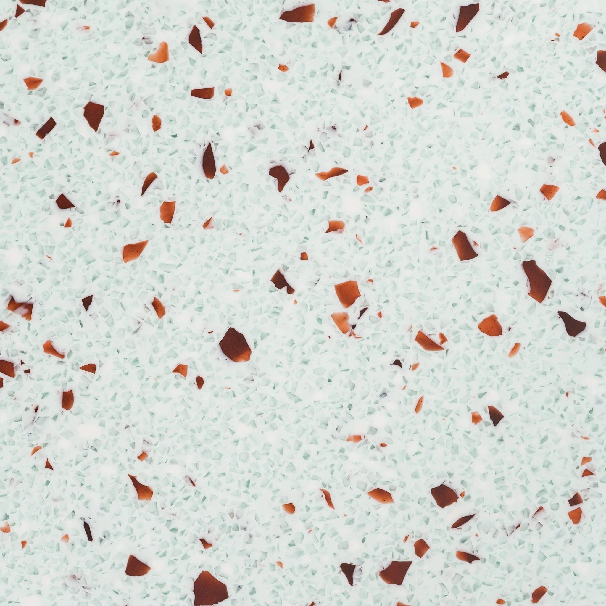 Patterned surface with small brown and orange pieces on a light green background - Polymer panel